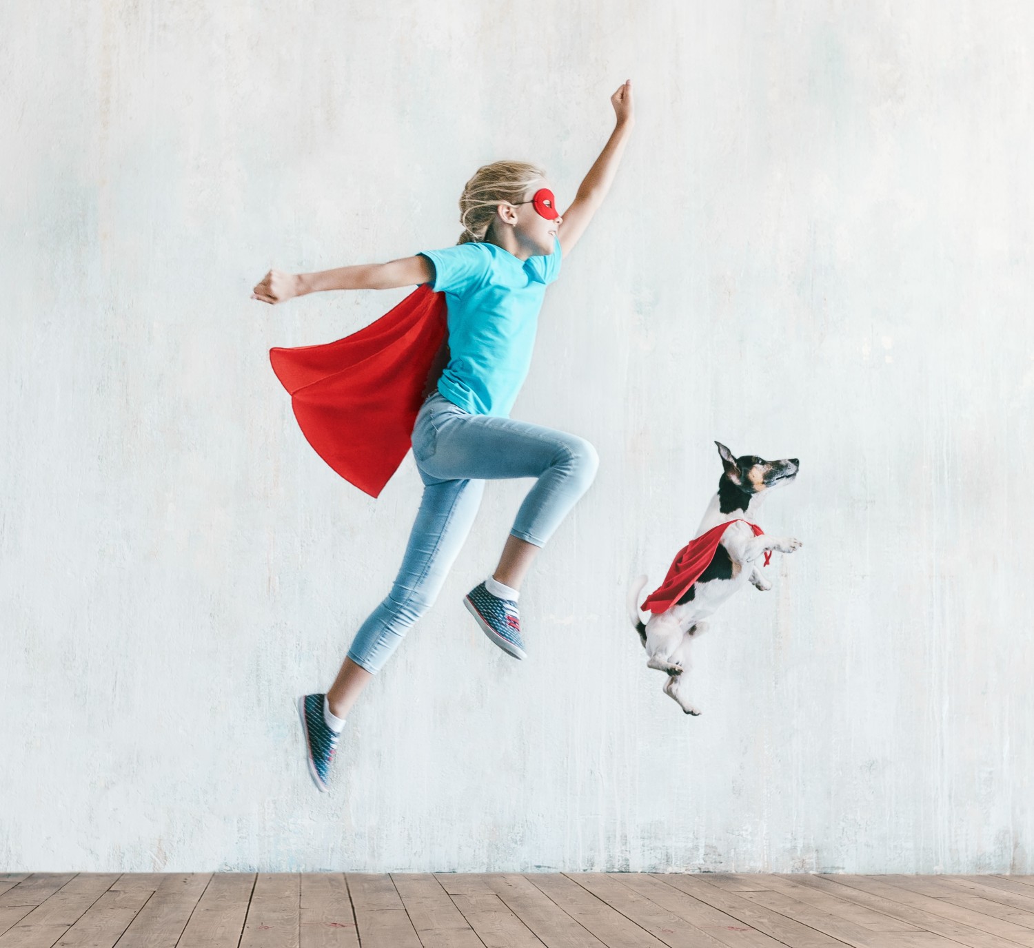 Hero Image - Girl and dog wearing capes